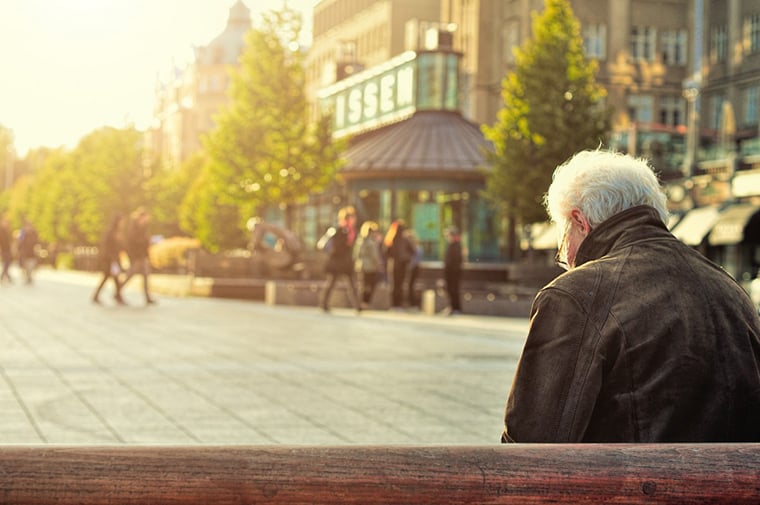 elderly man on bench outdoors 760w